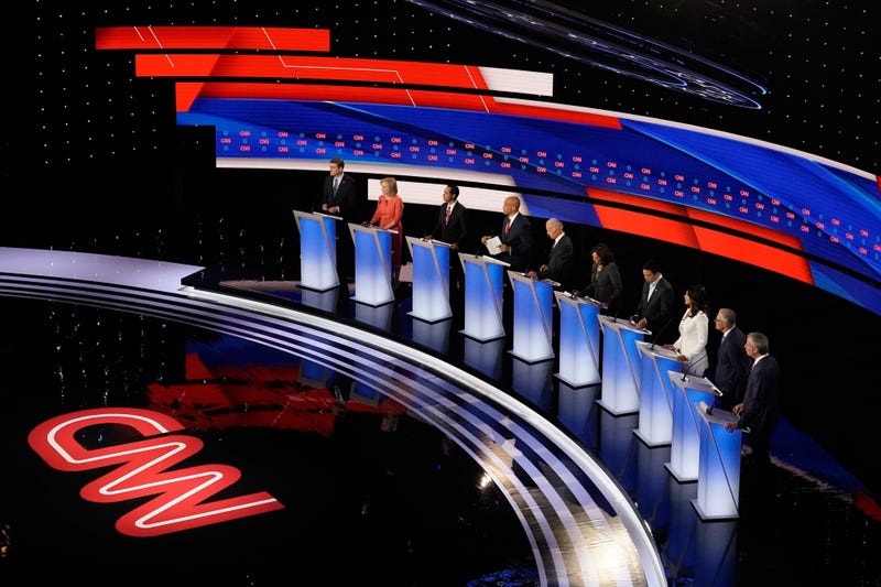 Presidential candidates Michael Bennet, Kirsten Gillibrand, Julián Castro, Cory Booker, Joe Biden, Kamala Harris, Andrew Yang, Tulsi Gabbard, Jay Inslee and Bill de Blasio participate in the CNN Democratic debate in Detroit on Wednesday, July 31.