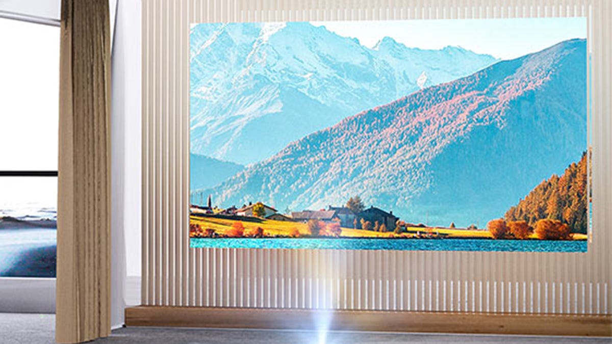 Enhance your at-home viewing experience with this portable projector and 50-inch screen