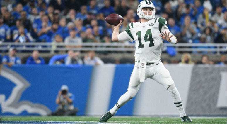 Sam Darnold drops back to pass during the second quarter against the Detroit Lions at Ford Field.