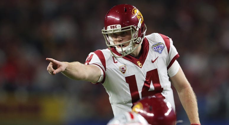 Sam Darnold signals prior to the snap of the ball against the Ohio State Buckeyes in the 2017 Cotton Bowl at AT&T Stadium.