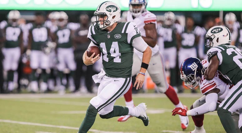 Jets quarterback Sam Darnold (14) rushes for yards during the first half against the New York Giants on Aug. 23, 2018, at MetLife Stadium.