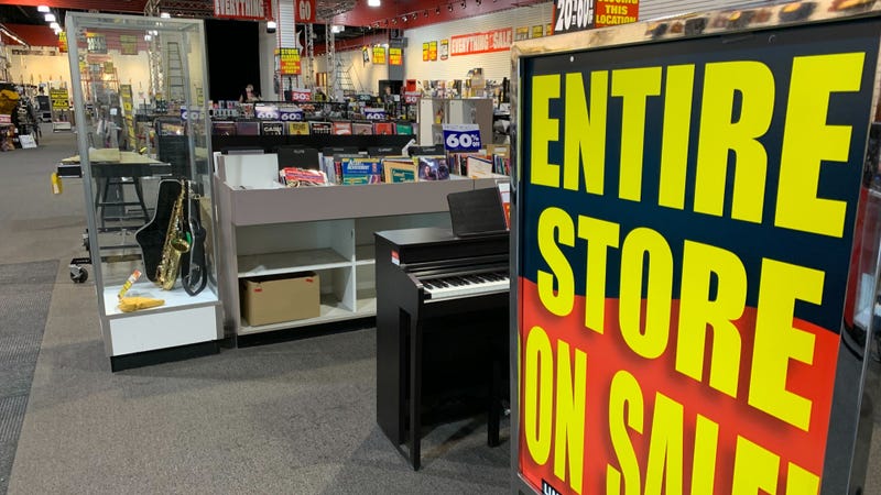 The Sam Ash music store in King of Prussia is lined with sale signs.