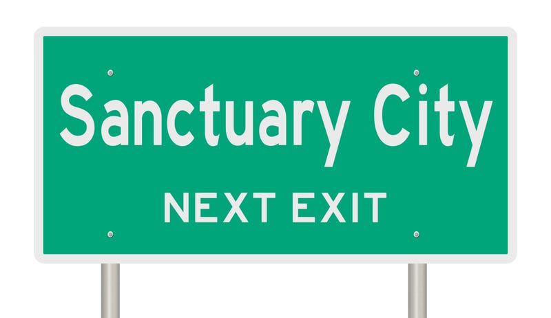 Sanctuary city highway sign