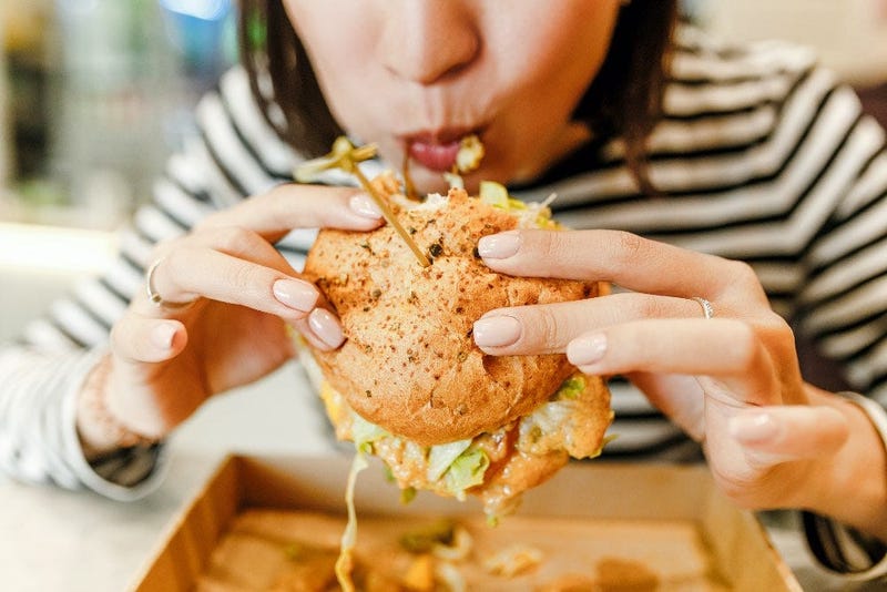 girl eating a sandwish