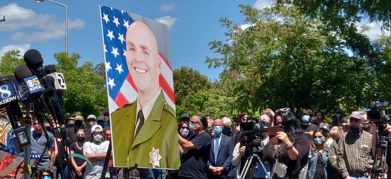 A picture of Sgt. Damon Gutzwiller at a vigil to honor the fallen deputy in Santa Cruz County.