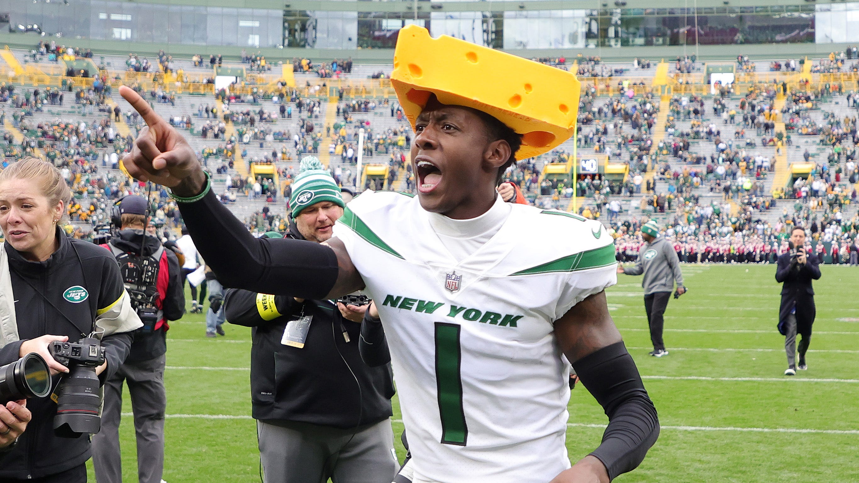 Sauce Gardner celebrates Jets win over Packers wearing cheesehead at Lambeau