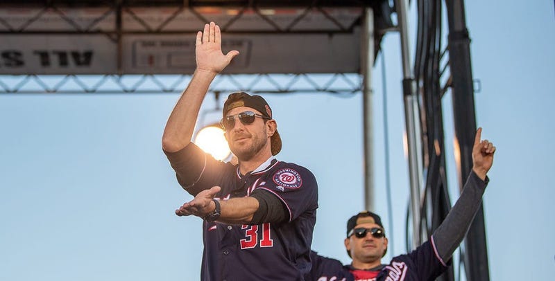 Washington Nationals players and coaches roll through the streets of Washington, D.C. and then speak on stage, celebrating their 2019 World Series championship with a few hundred thousand fans on November 2, 2019. 