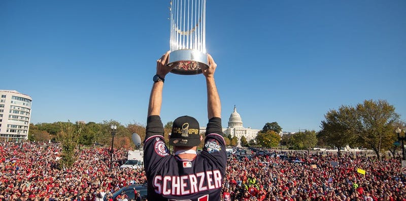 Washington Nationals players and coaches roll through the streets of Washington, D.C. and then speak on stage, celebrating their 2019 World Series championship with a few hundred thousand fans on November 2, 2019. 