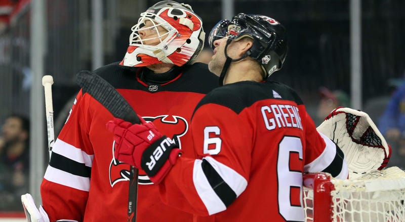 Dec 29, 2017; Newark, NJ, USA; Devils goaltender Cory Schneider (35) and New Jersey Devils defenseman Andy Greene (6) watch a replay during the third period of their game against the Buffalo Sabres. Mandatory Credit: Ed Mulholland-USA TODAY Sports