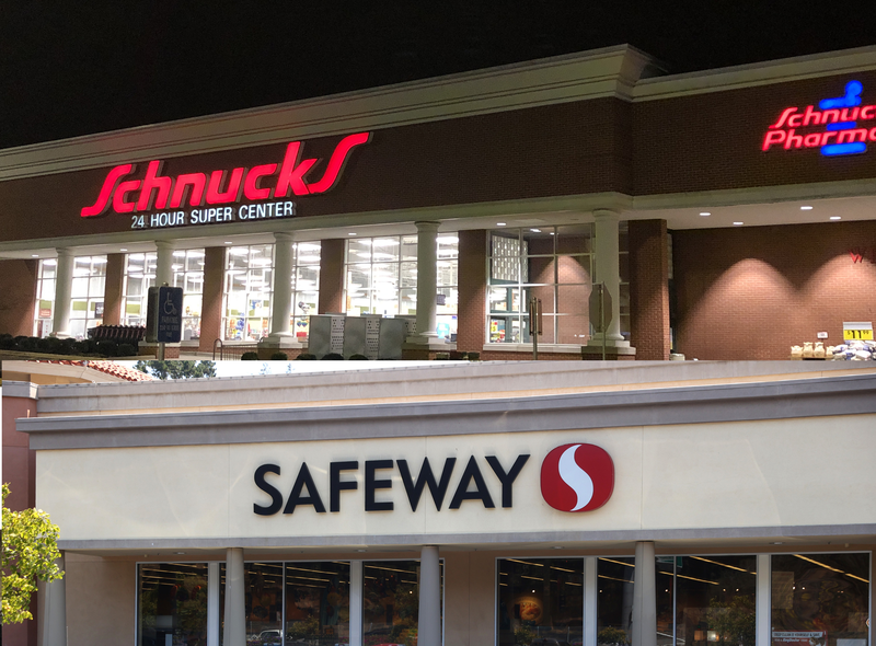 Outside signs of Schnucks and Safeway grocery stores