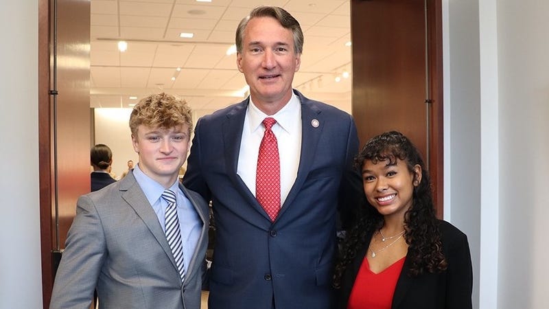 Edward McFall and Jenny Calderon with Virginia Governor Glenn Youngkin at the 67th annual Commonwealth's Memorial Day Ceremony