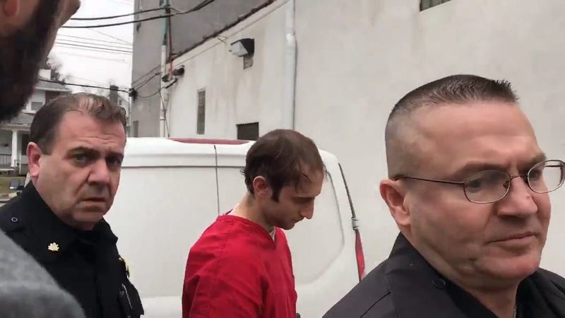 Robert Coult III (center) is escorted by police into district court in Lansdowne Tuesday, Jan. 8, 2019.