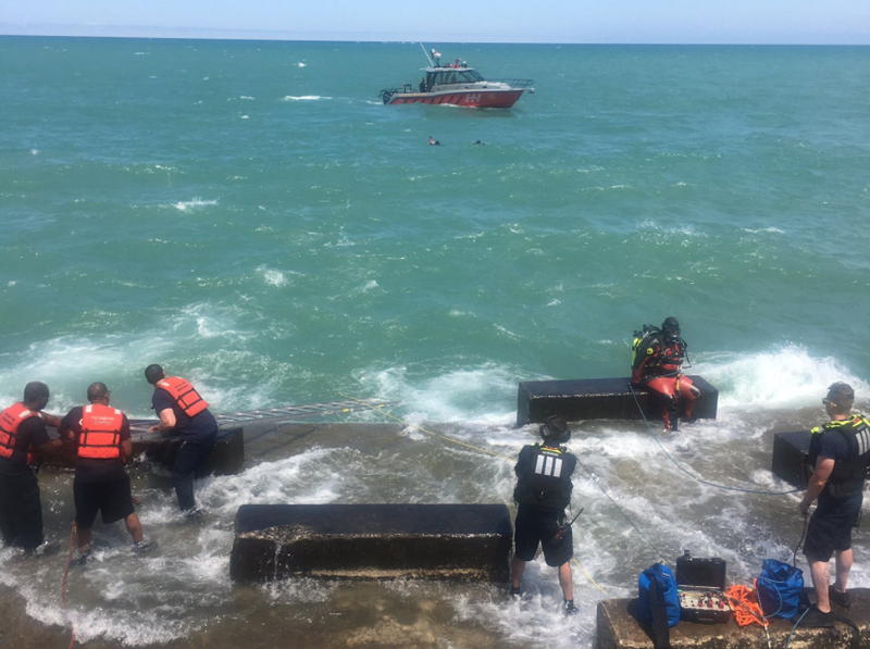 Divers search for a missing swimmer in Lake Michigan on July 17, 2020.