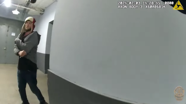 body cam footage of man holding plastic fork