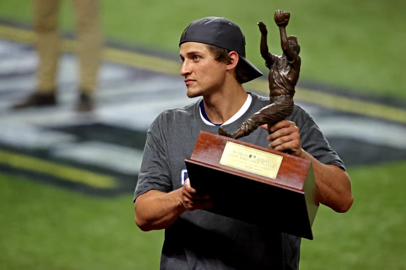 Corey Seager hoists the World Series MVP trophy. 