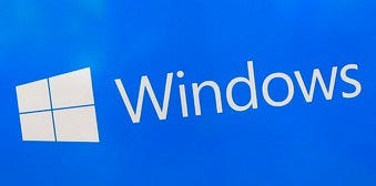 FILE - This Aug. 7, 2017, file shows a Microsoft Widows sign on display at a store in Hialeah, Fla. (AP Photo/Alan Diaz)