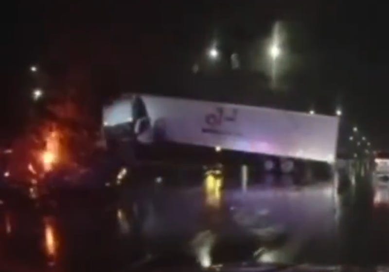 Semi crashes into median wall on I-696.