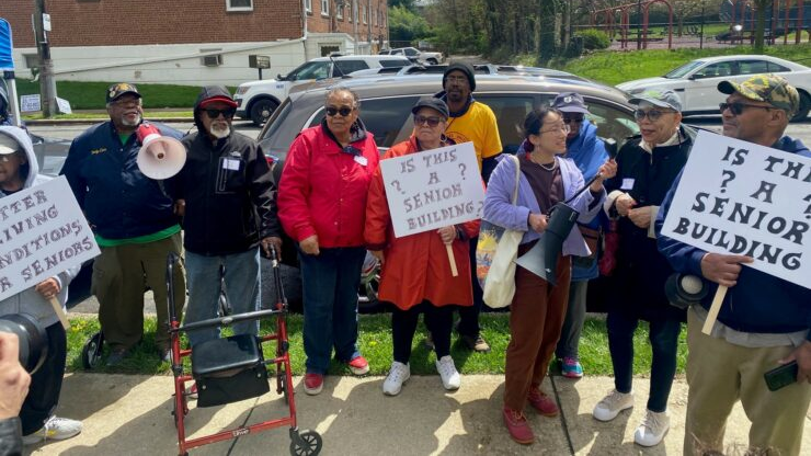 Marguerite Byrd (center) and other Brith Sholom House tenants, in April, protest the sale of the building.