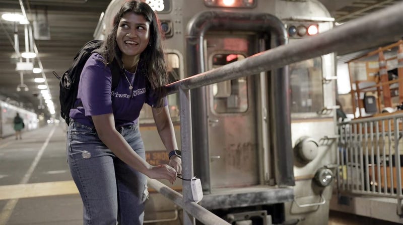 woman attaches sensor in Loop basement