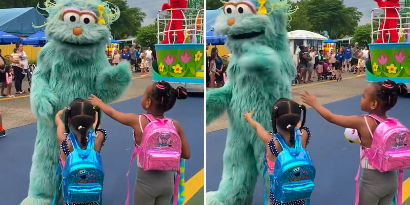 In this image from video provided by Jodi Brown, posted to Instagram on July 16, 2022, a performer dressed as the character Rosita waves off Brown's daughter and another 6-year-old Black girl at the Sesame Place amusement park in Langhorne.