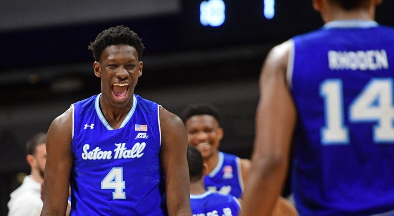 Seton Hall's Khadeen Carrington gets the ball pats North Carolina State's Allerik Freeman in the first round of the NCAA tournament on March 15, 2018, in Wichita, Kansas.