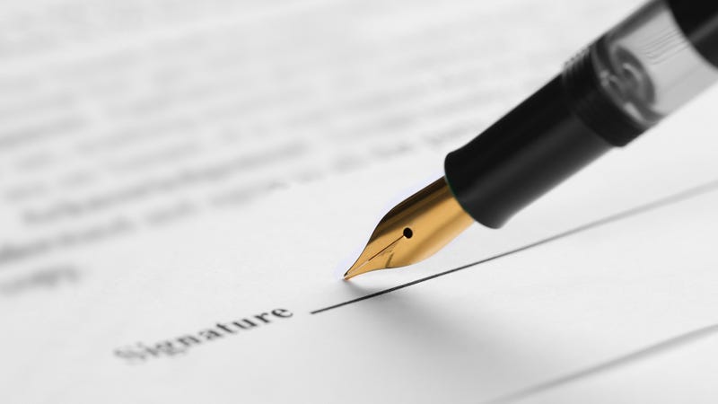 Signing document with fountain pen - stock photo