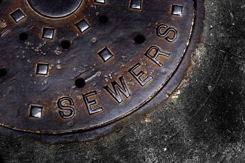 Man hole cover for sewer entry