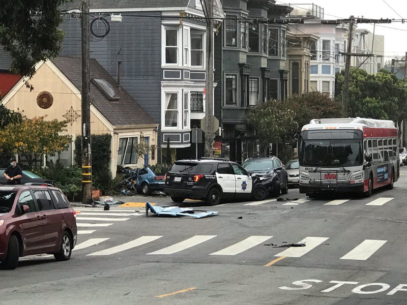 The wreckage of a crash involving a Honda Accord, SFPD squad car, MUNI bus and a home in San Francisco's Lower Haight neighborhood