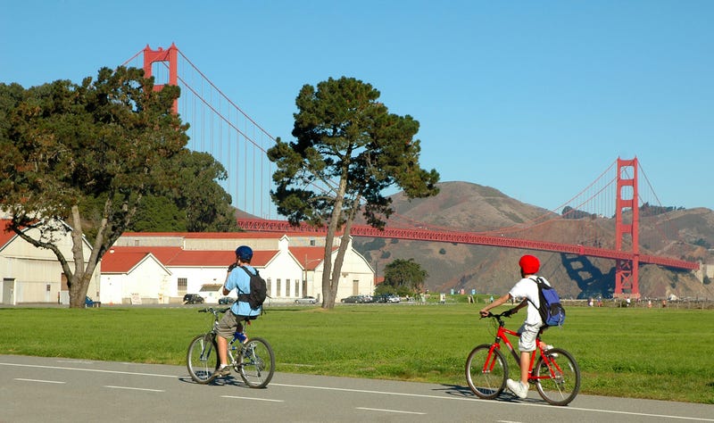 Cyclists in San Francisco near Golden Gate Bridge.