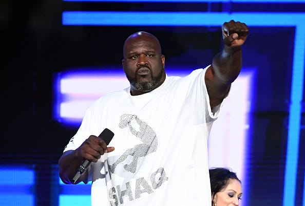 Shaquille O'Neal raps at the 2019 NBA Awards show.