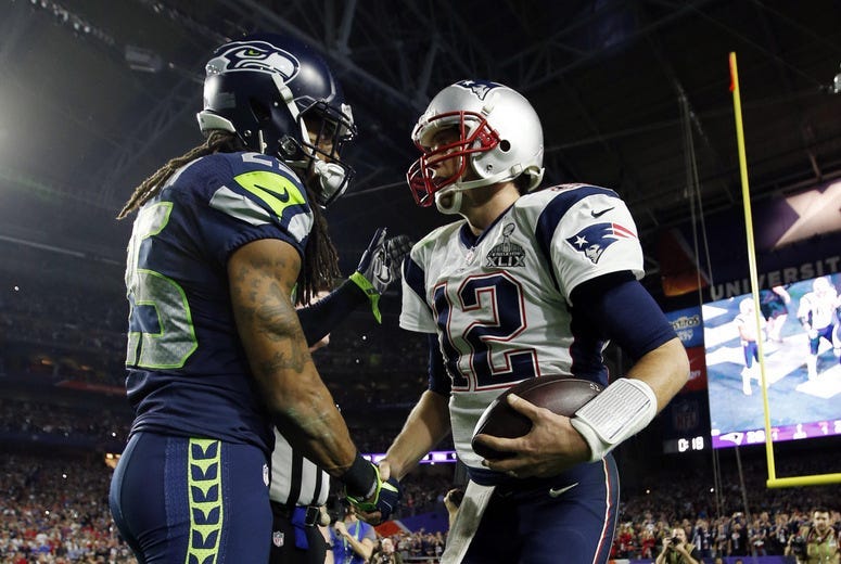 Richard Sherman shakes hands with Tom Brady after Super Bowl XLIX.