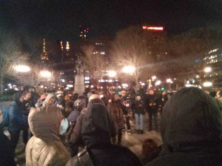 A crowd gathers around a speaker at Union Square. 