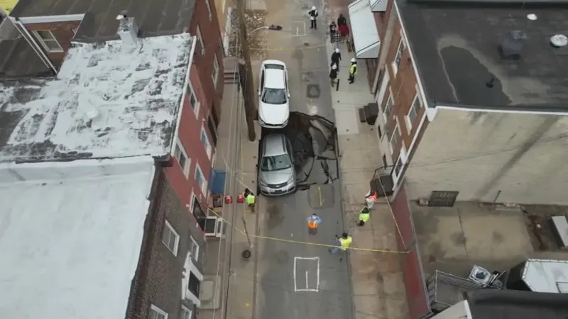 Sinkhole swallows car in Port Richmond