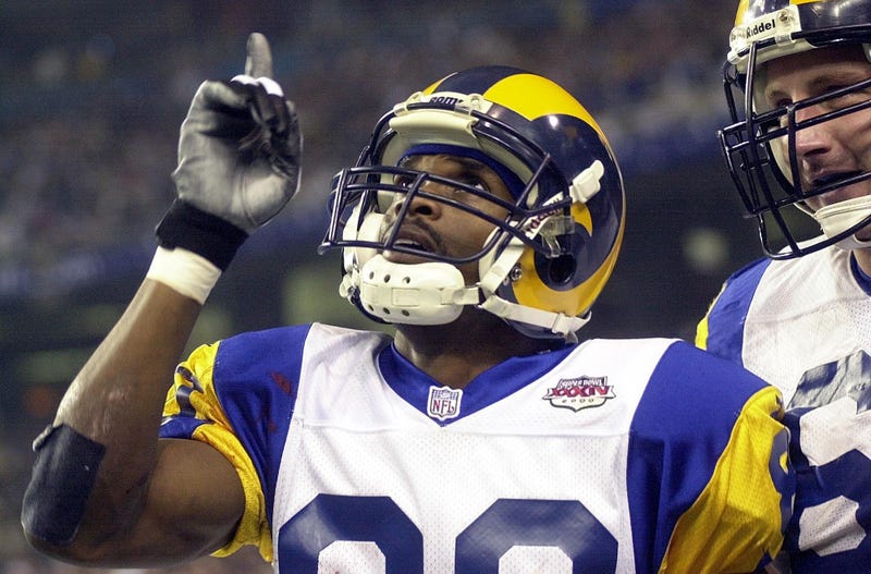 Louis Rams receiver Isaac Bruce celebrates during a 23-16 victory over Tennessee in Super Bowl XXXIV 