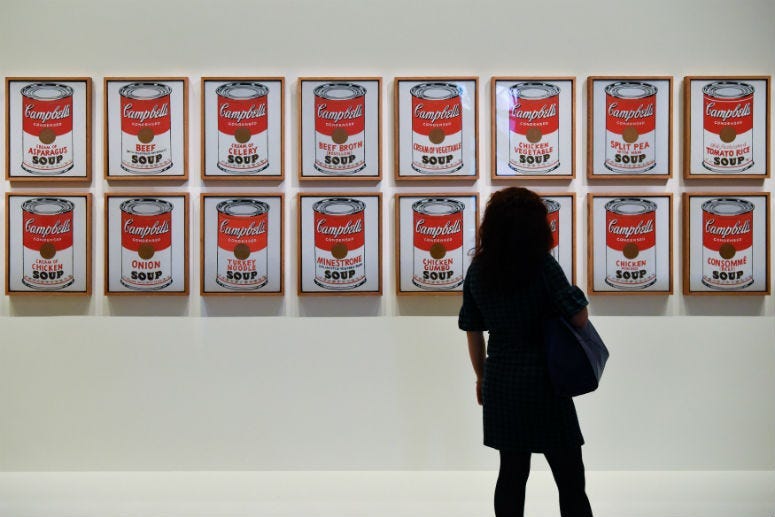 PARIS, Oct. 10, 2017 (Xinhua) -- A visitor looks at Andy Warhol's Campbell's Soup Cans during a media preview for the exhibition "Being Modern: MoMA in Paris" at Foundation Louis Vuitton in Paris, France, on Oct. 10, 2017.