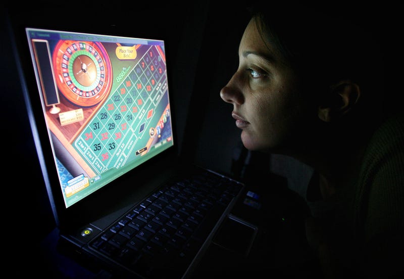 A woman using an internet gambling website to play online roulette. 
