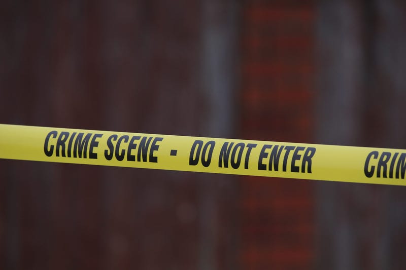 A generic stock photo of crime scene tape at a murder investigation site.