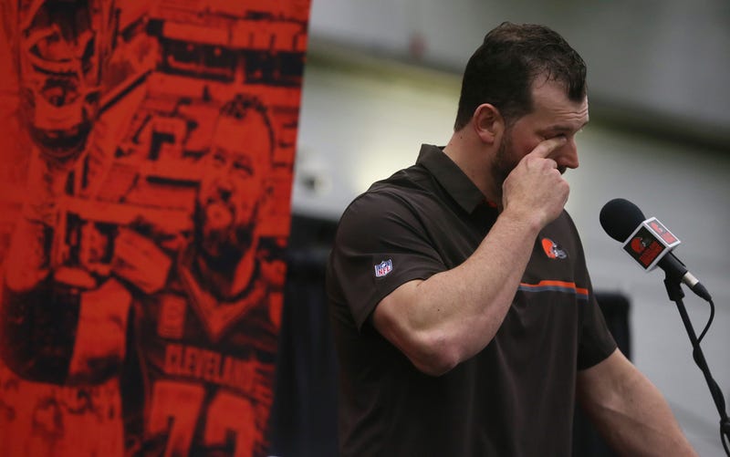 Cleveland Browns offensive tackle Joe Thomas wipes away a tear after learning the beat writers renamed the player of the year award the Joe Thomas award during his retirement press conference at the Cleveland Browns training facility on Monday, March 19, 