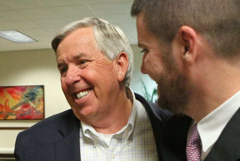 Mike Parson, left, celebrates his election as Lieutenant Governor of Missouri, on November 8, 2016, at the Oasis Convention Center in Springfield, Mo.