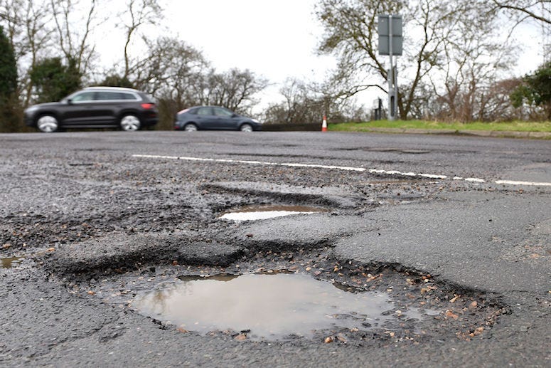 potholes, michigan, 12 year old, boy, michigan potholes