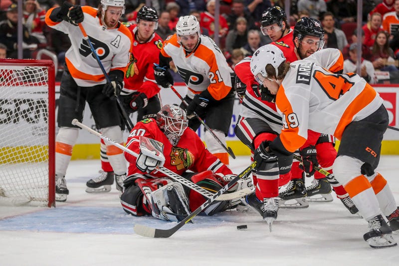 Chicago Blackhawks goaltender Robin Lehner (40) guards the net while the Philadelphia Flyers' Joel Farabee (49) looks to score amid second-period traffic at the United Center in Chicago on Thursday, Oct. 24, 2019.