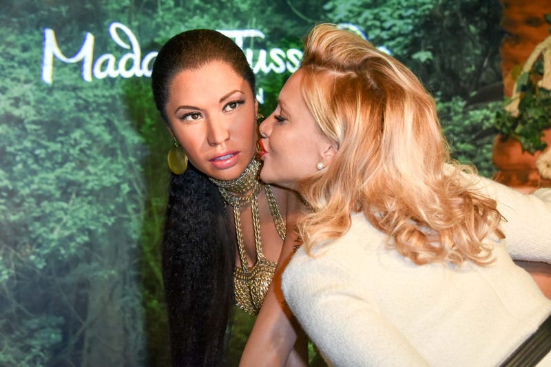 Evelyn Burdecki, influencer, is standing next to the wax figure of singer Nicki Minaj at Madame Tussauds