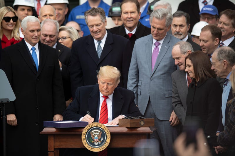 U.S. President Donald Trump signs the United States-Mexico-Canada Agreement 