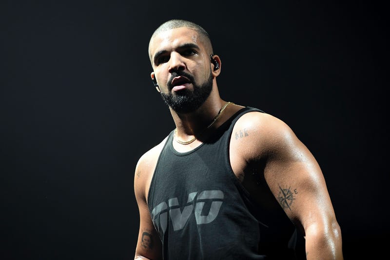 Drake in black tank top
