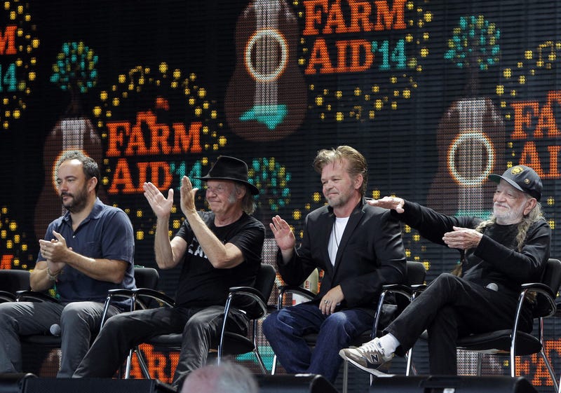 From left, Dave Matthews, Neil Young, John Mellencamp, and Willie Nelson applaud a farmer during a news conference held before the Farm Aid '14 concert. All are scheduled to appear in Minneapolis for Farm Aid but now that show is in doubt due to a strike.