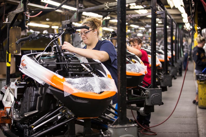 Workers assemble the 2016 Lynx 2000 snowmobile at the Arctic Cat factory in Thief River Falls, Minnesota.