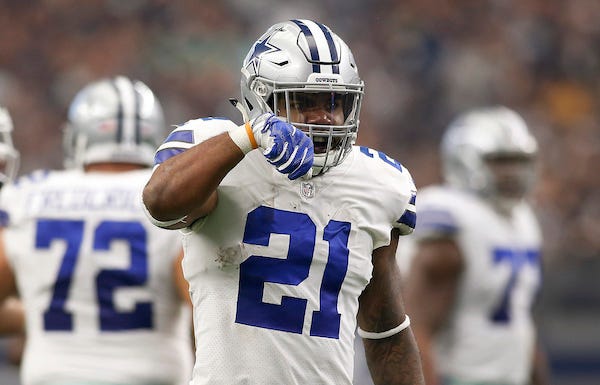 Dallas Cowboys running back Ezekiel Elliott (21) displays his "feed me" sign after a first down run