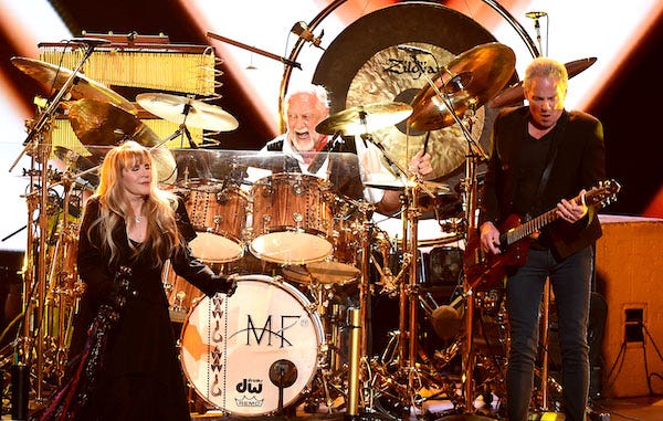 Stevie Nicks, Mick Fleetwood, and Lindsey Buckingham of Fleetwood Mac appear at the 2018 MusiCares Person of the Year honoring Fleetwood Mac