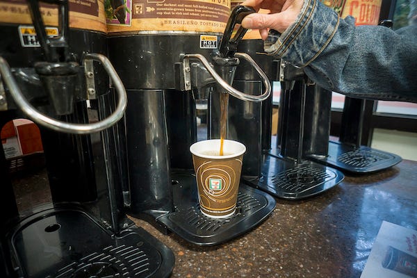 A coffee drinker fills up her cup at a 7-Eleven store