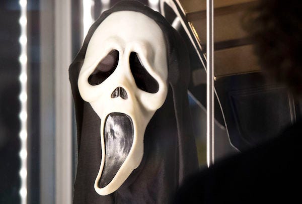 A Ghostface mask used in Scream at the Prop Store film memorabilia exhibition at the BFI IMAX at Waterloo in central London
